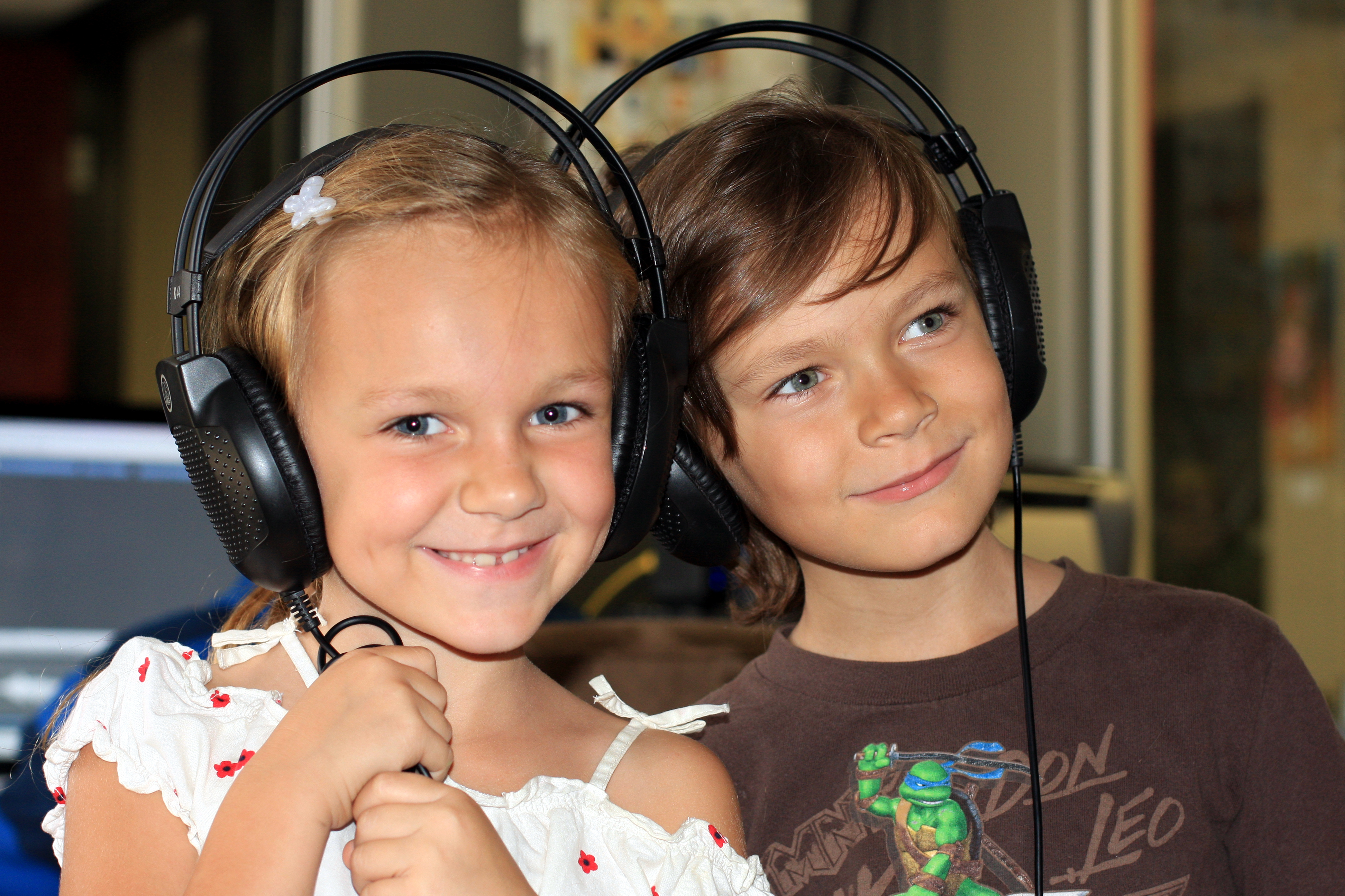 Siblings, KristiLynn Effie & Mikey Effie in the recording studio working on a voice over.