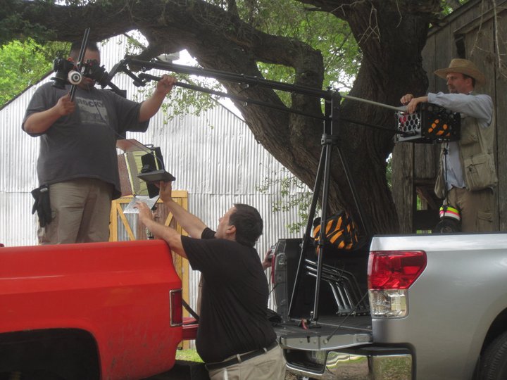 Michael Walters assisting Carlos Tovar with setting up the next shot in 