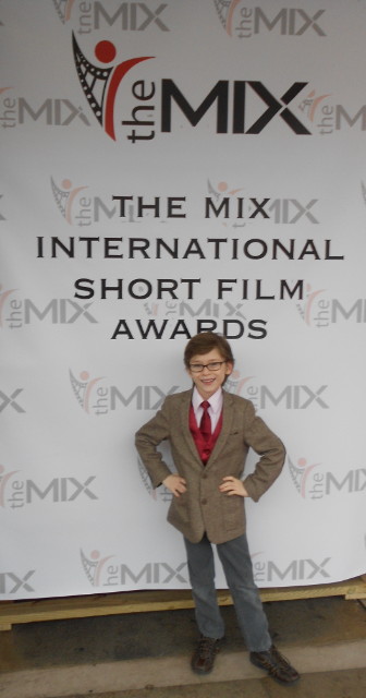 Aidan Fiske on the red carpet for the premiere of Trading Ages