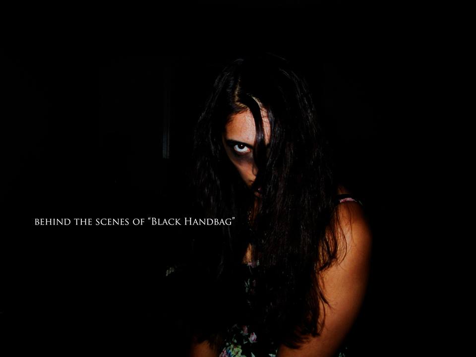 Teaser photo for Black Handbag, directed by Andre Douglas