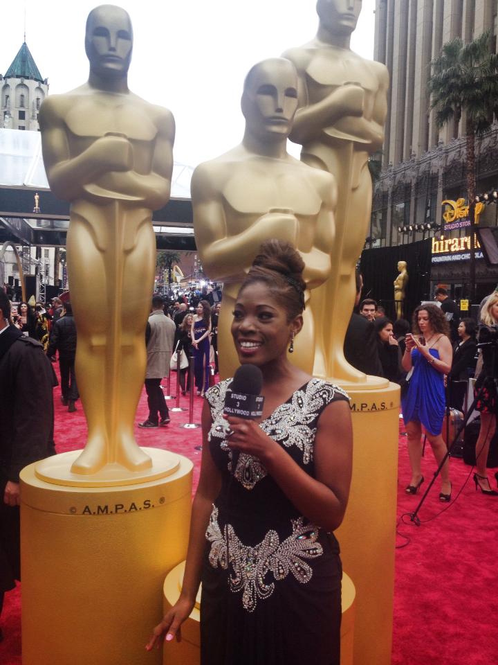 Host of Studio 3 Hollywood, Tysha live on the Red Carpet arrivals for the 56th Annual Academy Awards. Wearing Shekhar Rehate designer gown and American Gem Company Jewelry