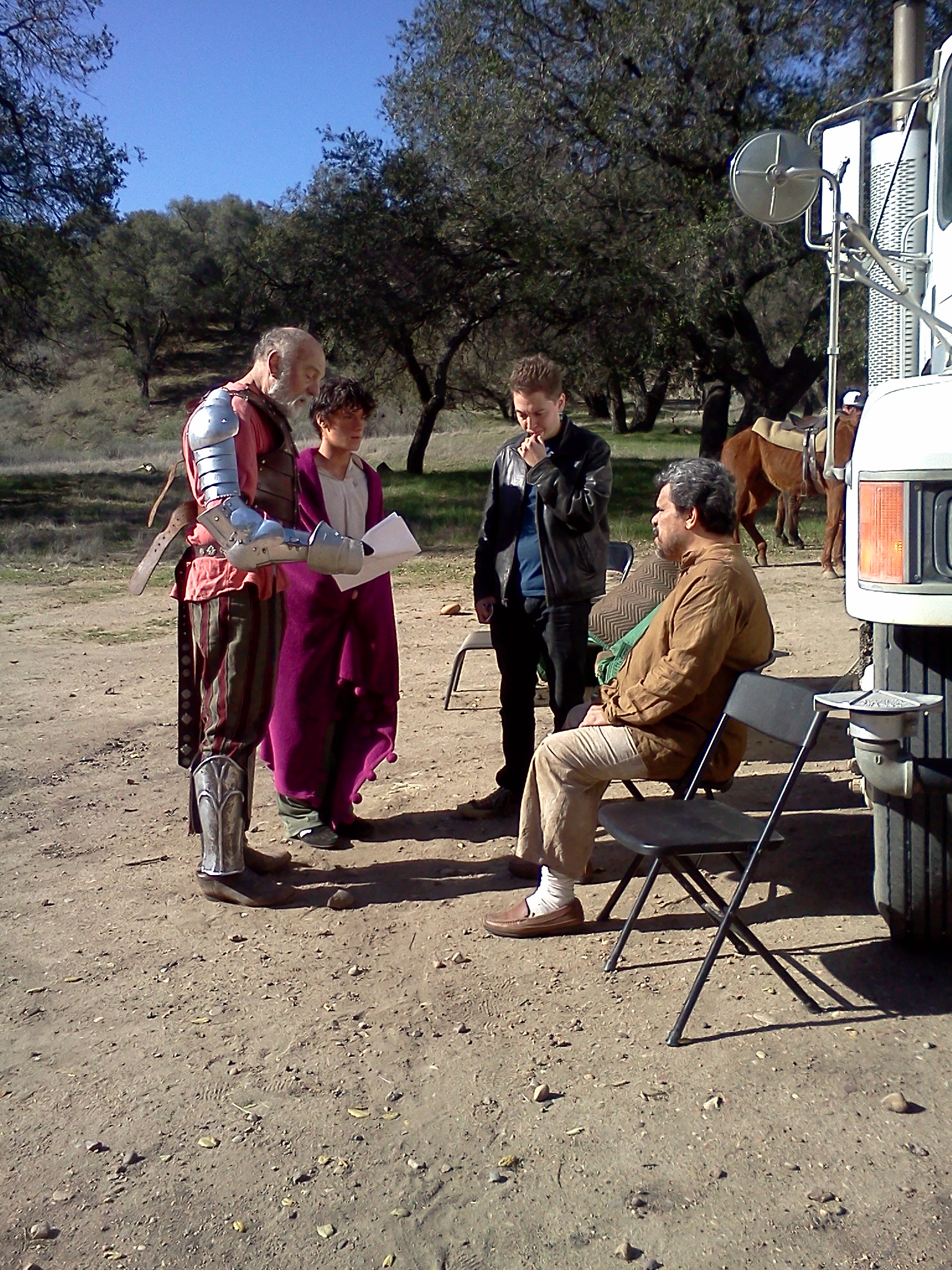 William Leon collaborating with Carmen Argenziano, Luis Guzman, and Director David Beier on the set of Don Quixote