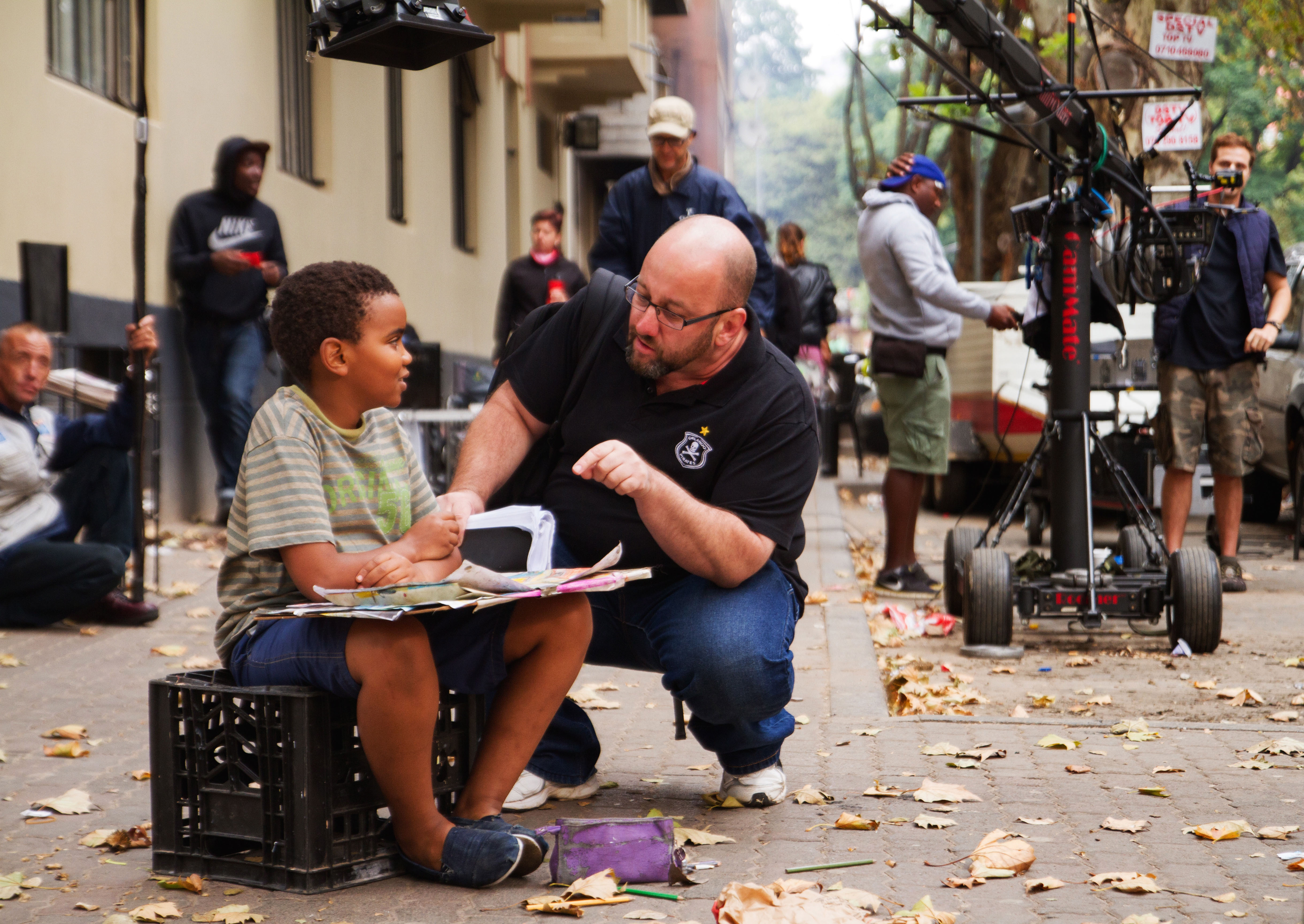 Director Konstandino Kalarytis and actor Paballo Koza on location in Hillbrow, South Africa on the film Dora's Peace.