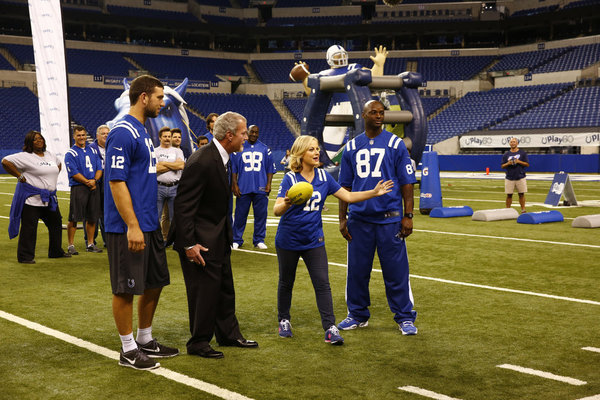 Still of Adam Scott, Jim Irsay, Jim O'Heir, Nick Offerman, Amy Poehler, Adam Vinatieri, Reggie Wayne, Robert Mathis and Andrew Luck in Parks and Recreation (2009)