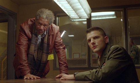 Grimes (MORGAN FREEMAN) and Embry (ADAM SCOTT) share an intense moment while preparing for a military trial.