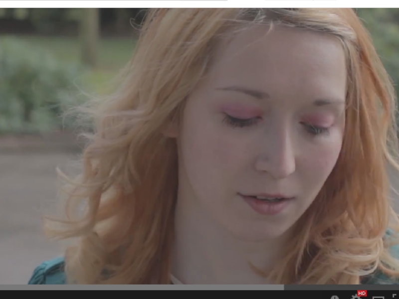 Rose in a snap shot from Fallen Floral's 'Sunshine through the Rain' music video.