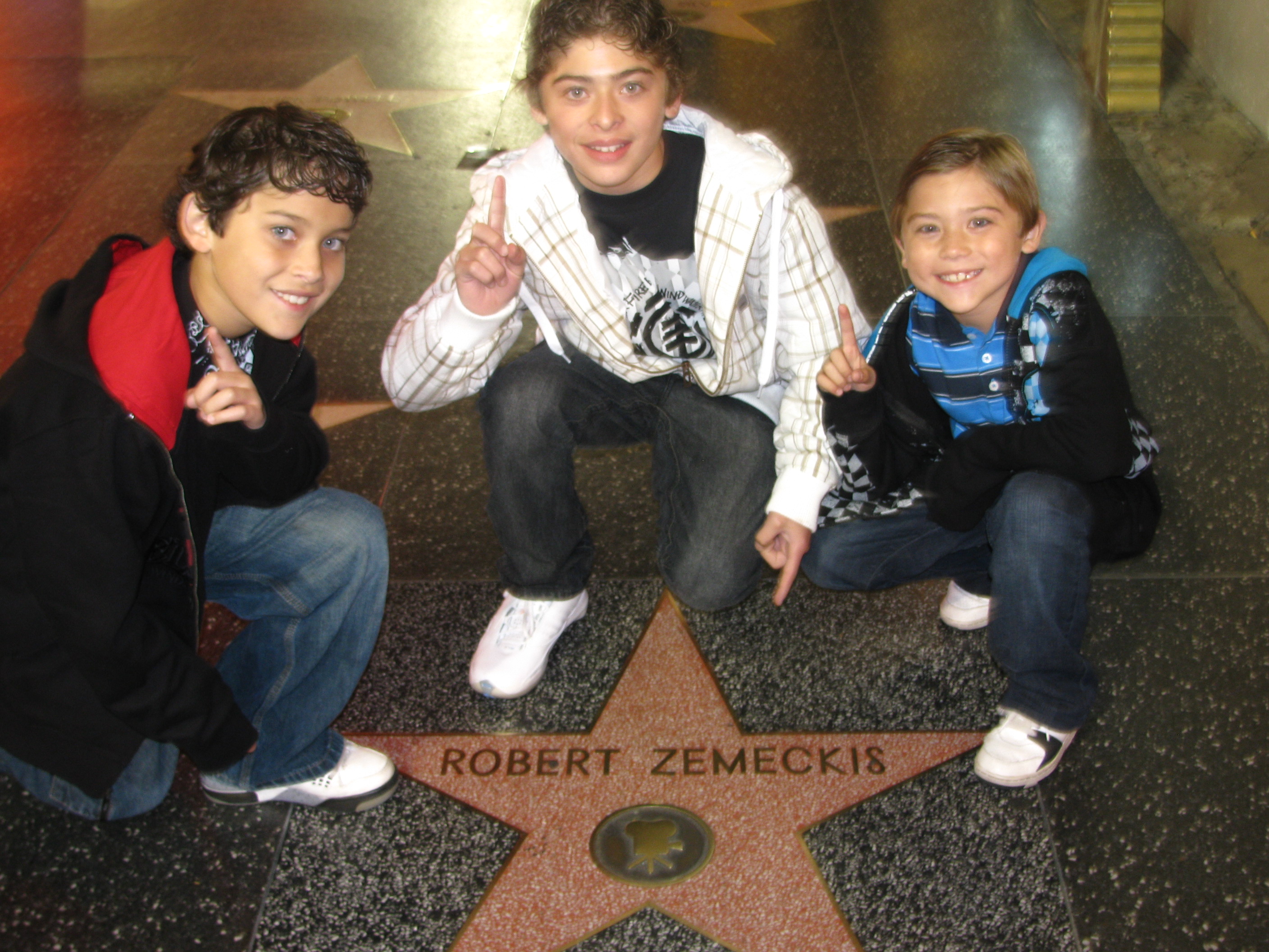 Robert, Ryan, and Raymond Ochoa in front of Director Robert Zemeckis' star on The Hollywood Walk of Fame