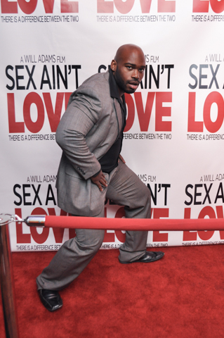 Calvin Thomas on the red carpet at the Sex Ain't Love Premiere at the Chicago Icon Theater