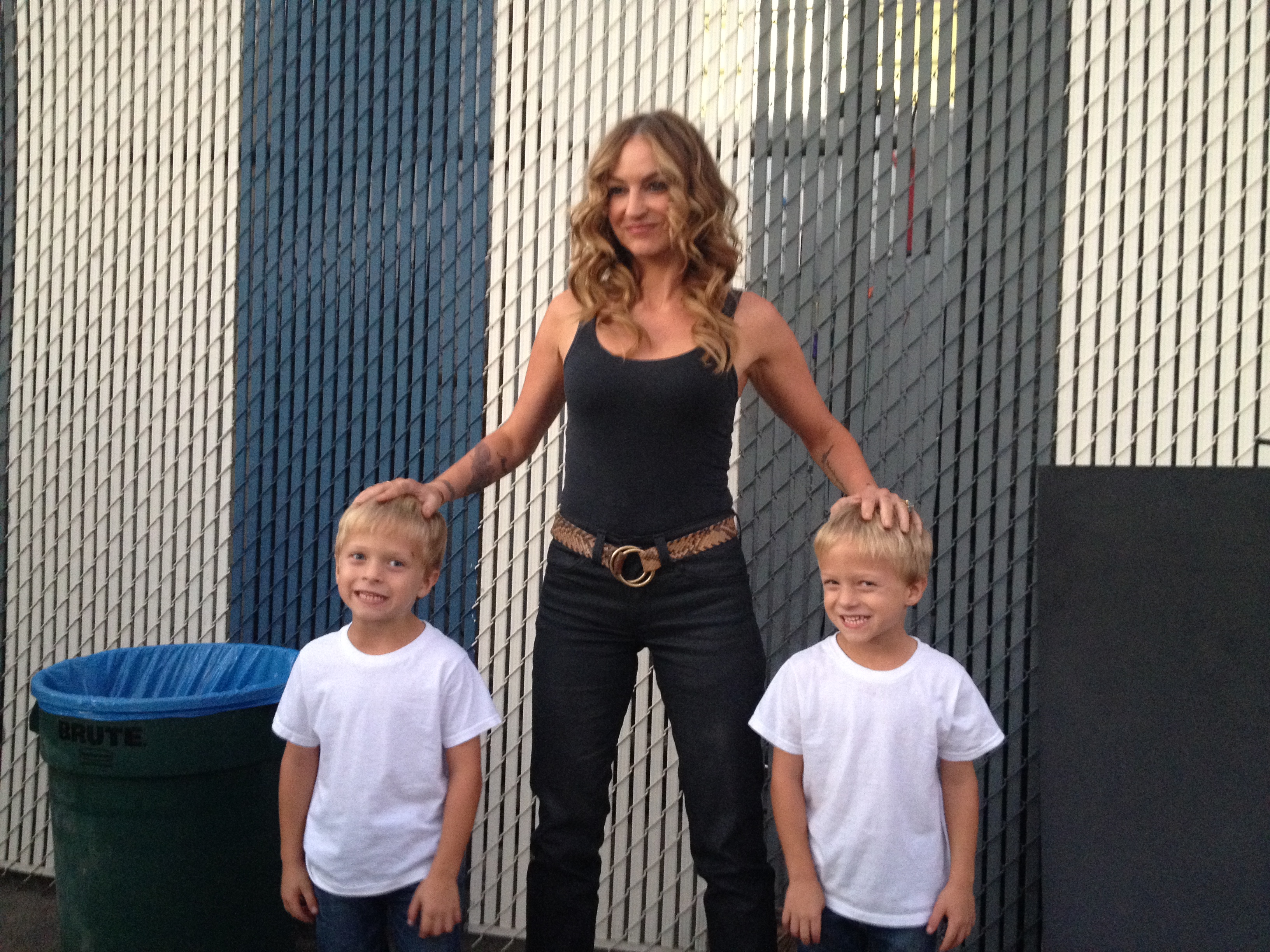 Evan Londo with twin brother Ryder and Drea De Matteo on the set of Sons of Anarchy Season 7