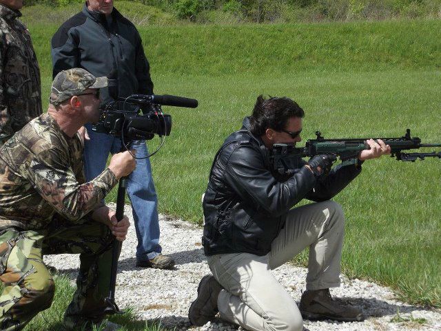 With Patrick Kilpatrick while shooting at the range in 