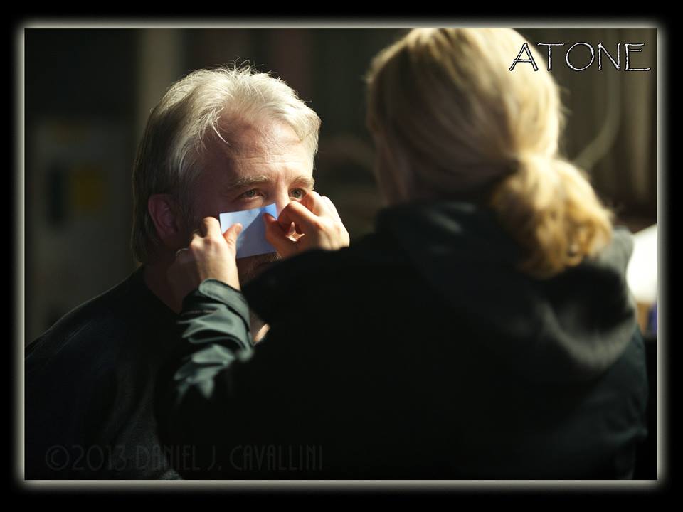 Jim Dougherty being touched up before going on camera by Kim Conolly.