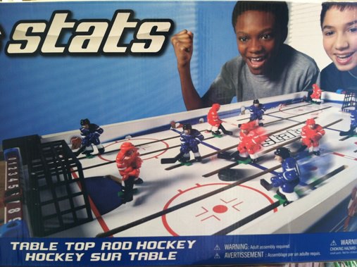Justin Myrick on the toy box cover of Stats Hockey at Toys R Us