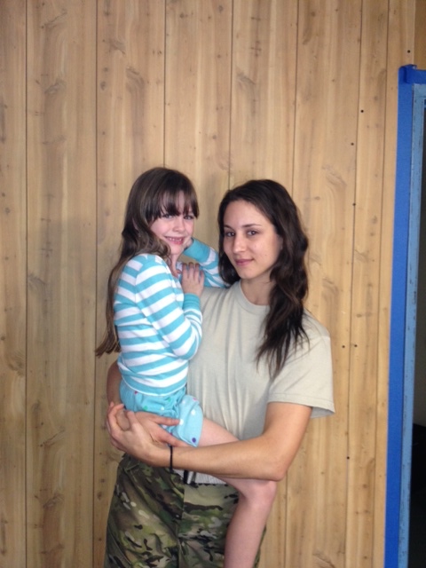 Afra with Troian Bellisario on the set of 