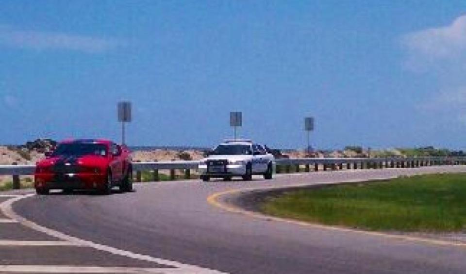 Movie cop car chasing our Shelby GT500 in a screenshot from 