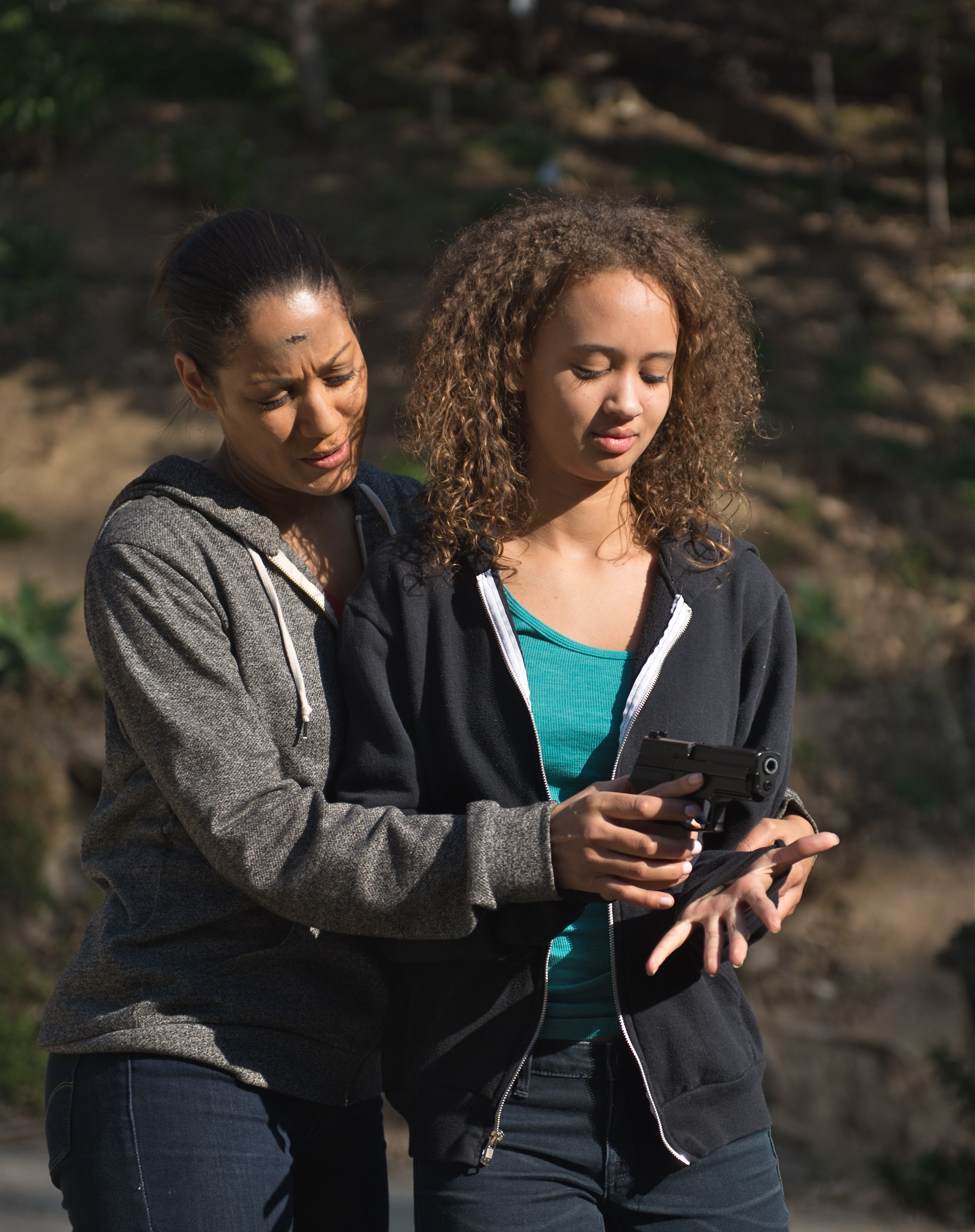 Still shot Cynthia Kaye McWilliams and Zayden Bates in Surviving The Dead.