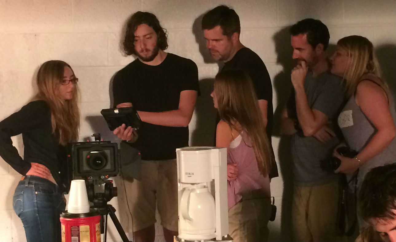 Kylie with directors Mark Clauburg & Peter Lisowsky reviewing scene she just performed in 