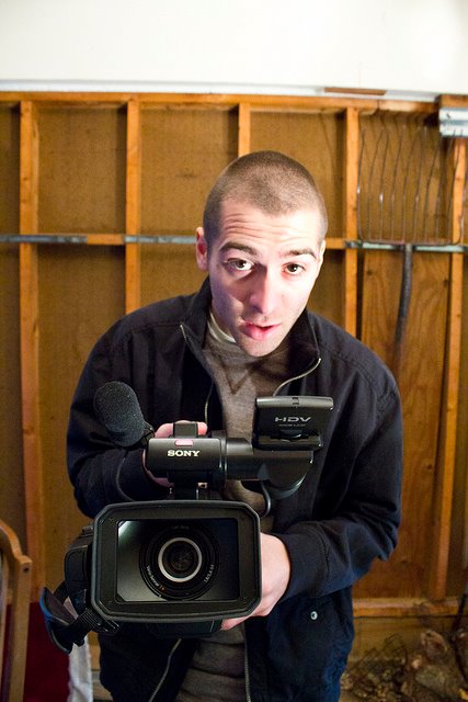 Cliff setting up a shot on the set of American Canvas