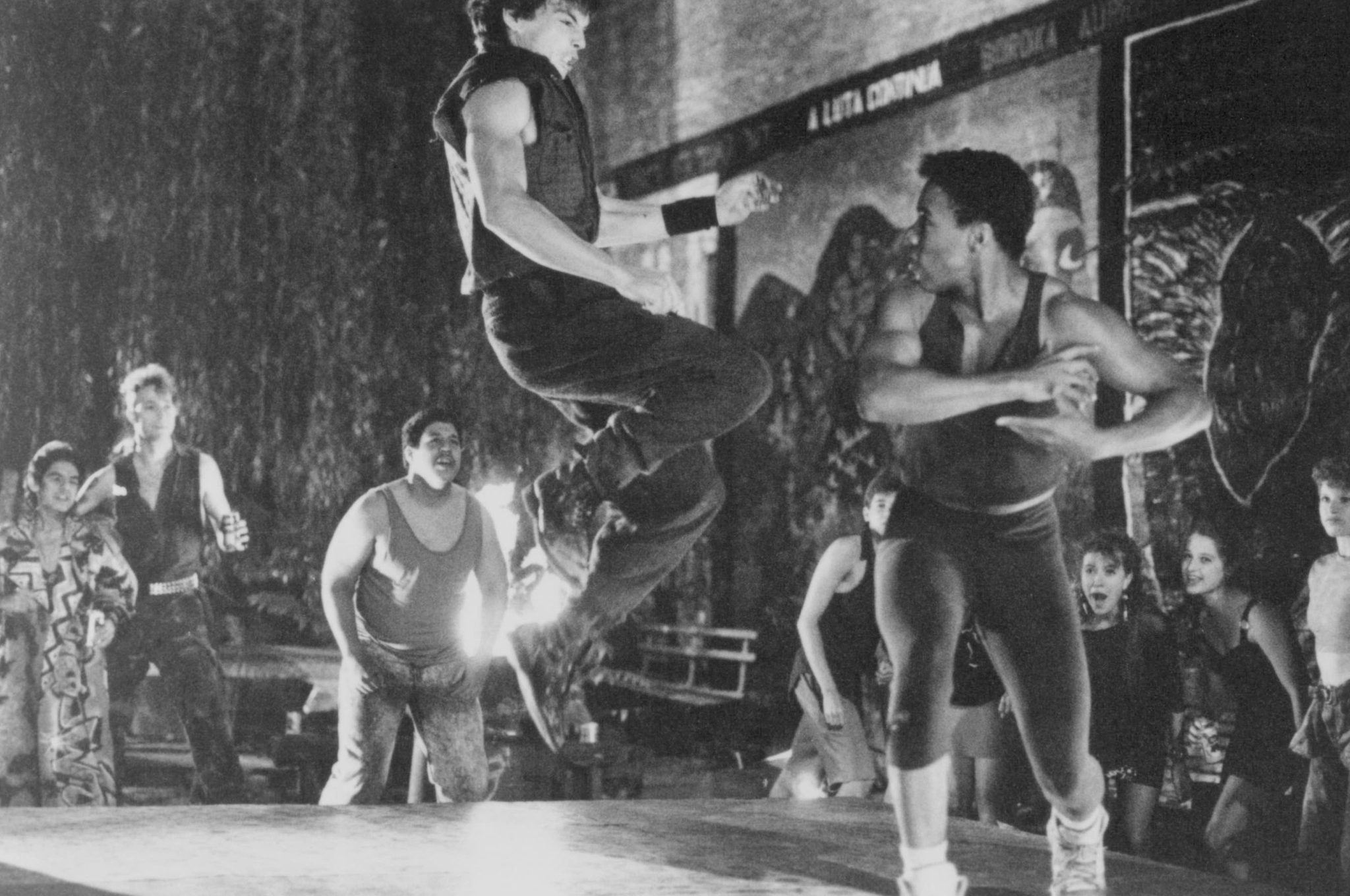 Still of Jason Gedrick, Troy Byer and Alexis Cruz in Rooftops (1989)