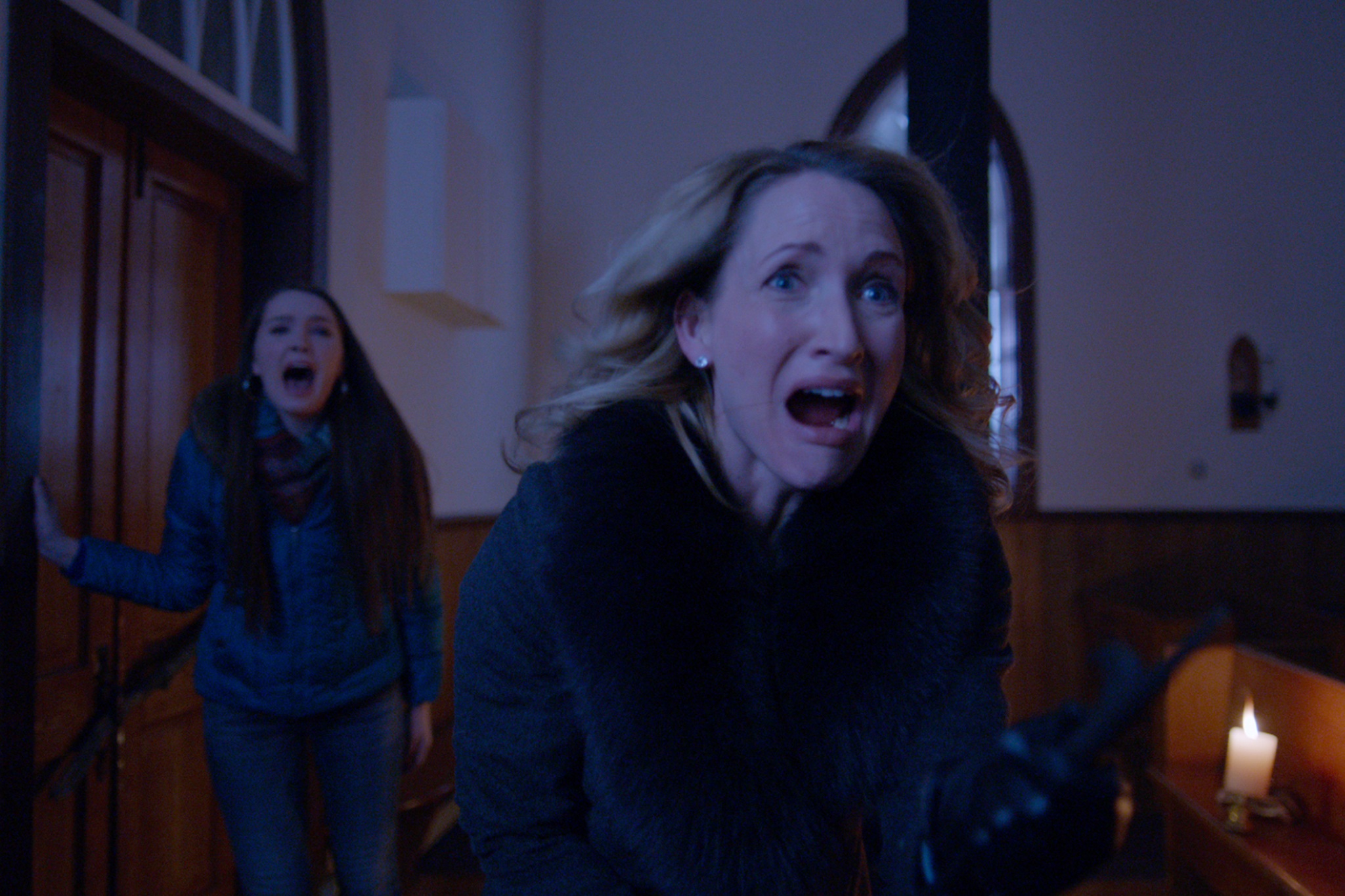 Still of Michelle Nolden and Amy Forsyth in A Christmas Horror Story (2015)