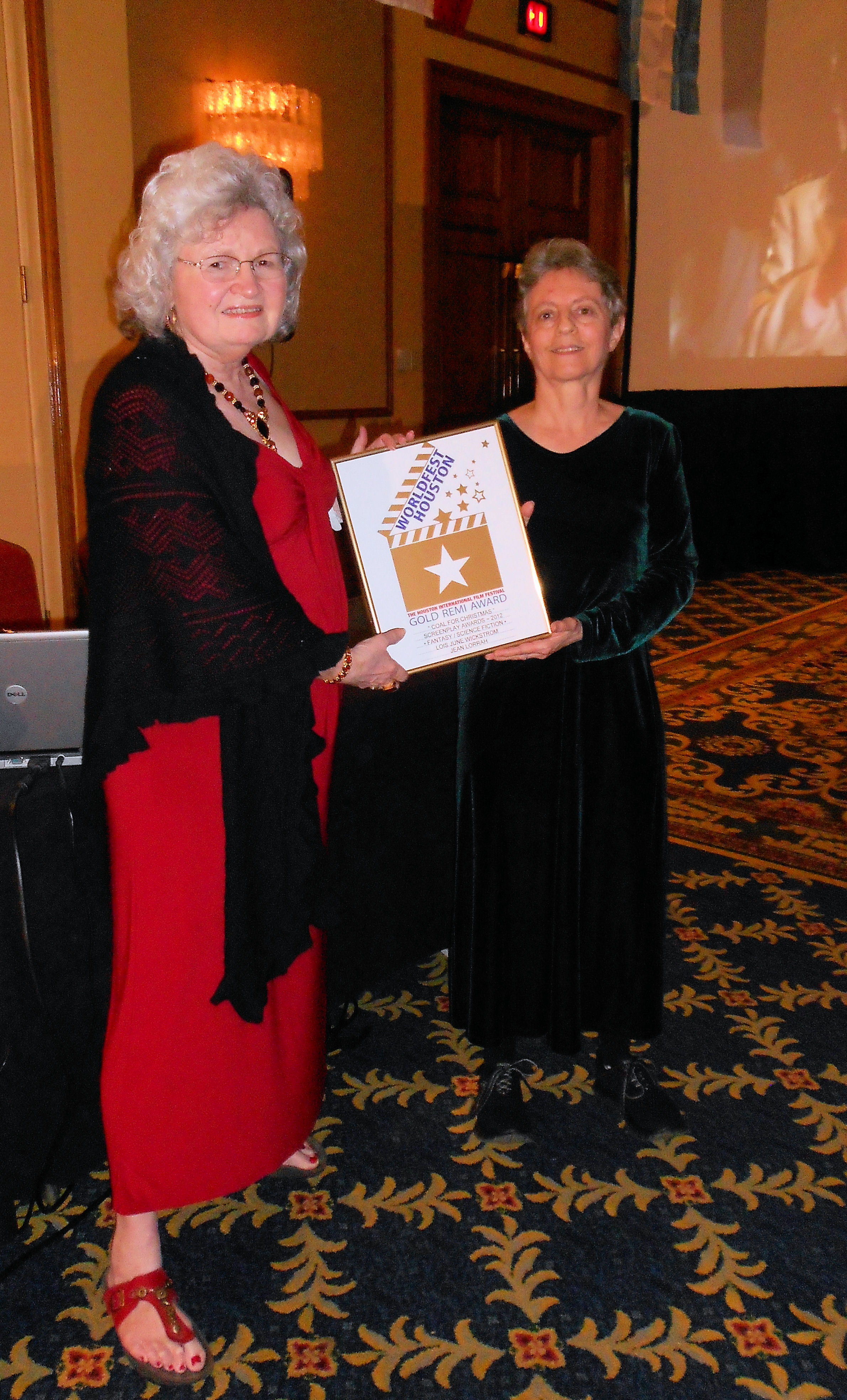 Jean Lorrah (left) and Lois Wickstrom (right) with their Gold Remi for Family Screenplay, WorldFest 45, April, 2012.