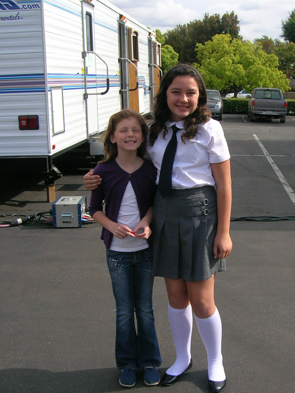 Ella Rouhier and Amara Miller on the set of 