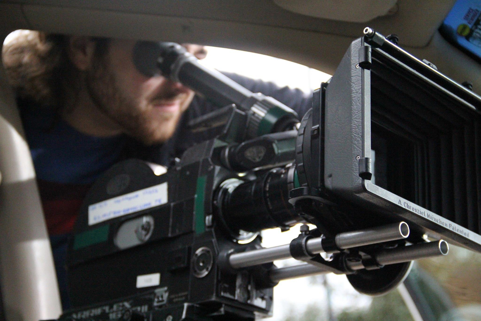 Writer/Director Kyle Taubken framing a shot on the set of JOEY AND AUGUSTE.