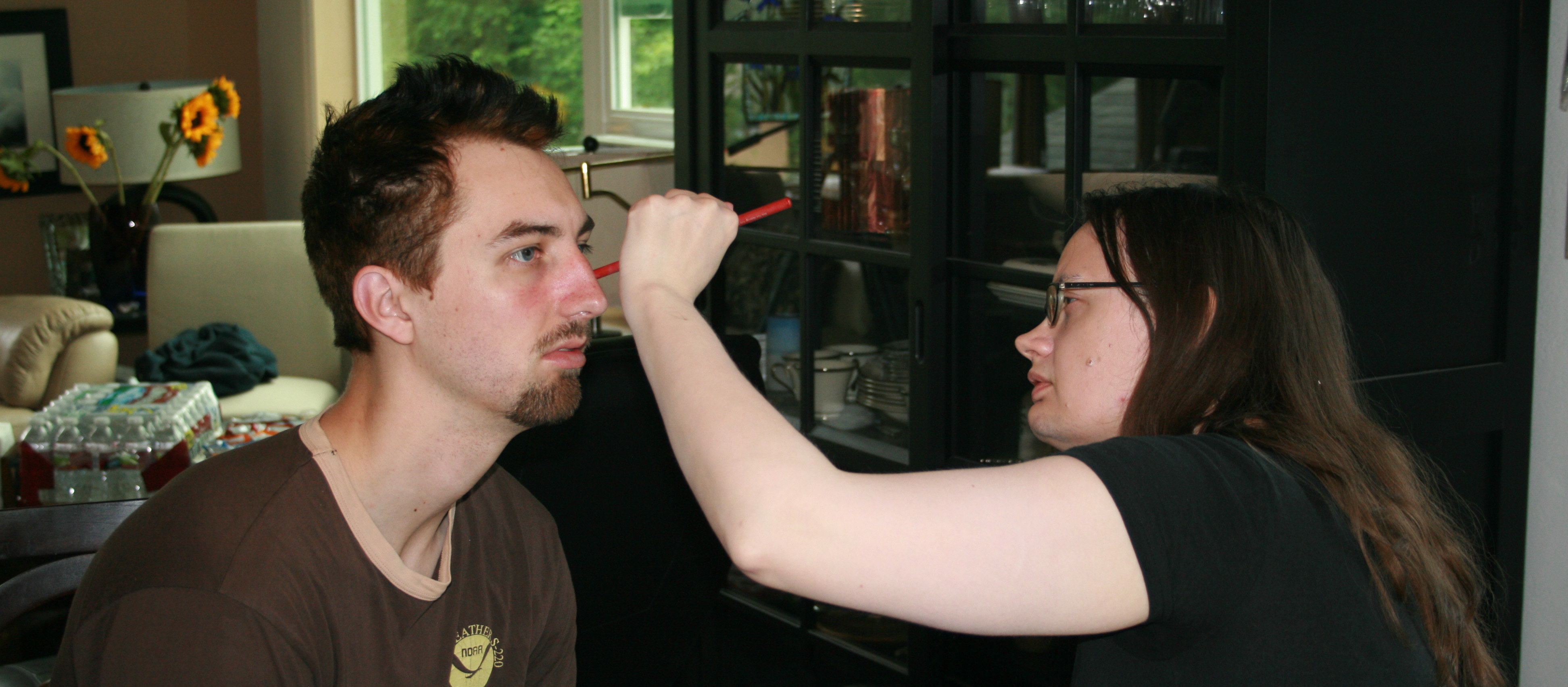 Behind the scenes: special effects makeup artist Anita Ashbaugh applies signs of alcoholism to Llian Breen in preparation for the scene 