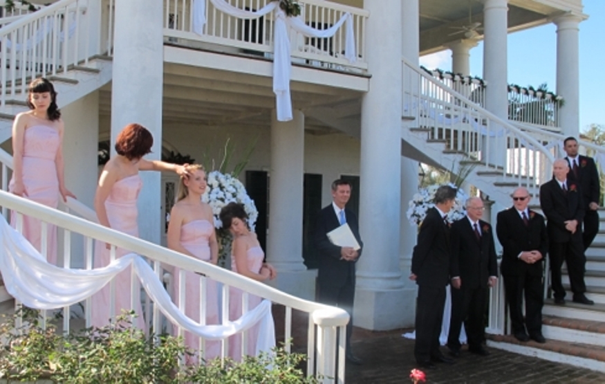 Still of Gus Rhodes (center)in the role of Pastor David Tomayo on the set of 