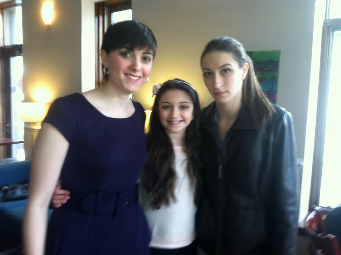 Still of Rebecca Stern with her two moms on set 
