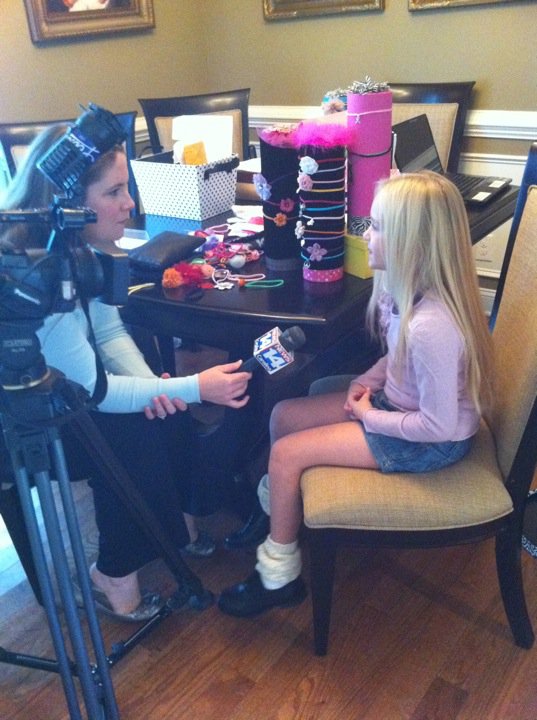 Maggie being interviewed by Fox news 14.