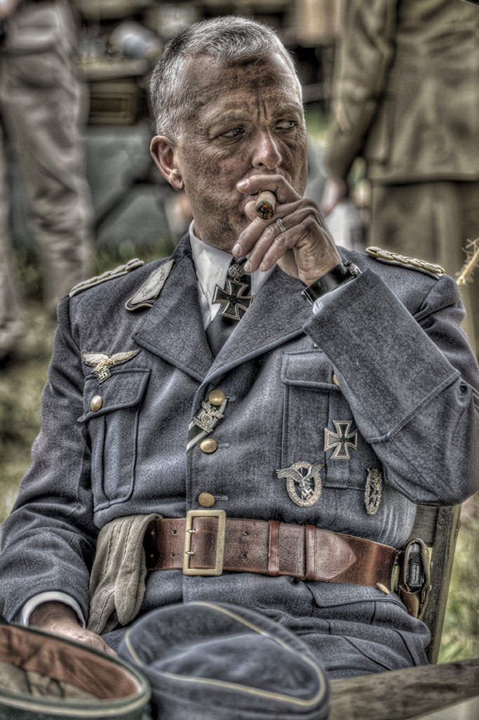 As a dirty and tired, captured German officer.