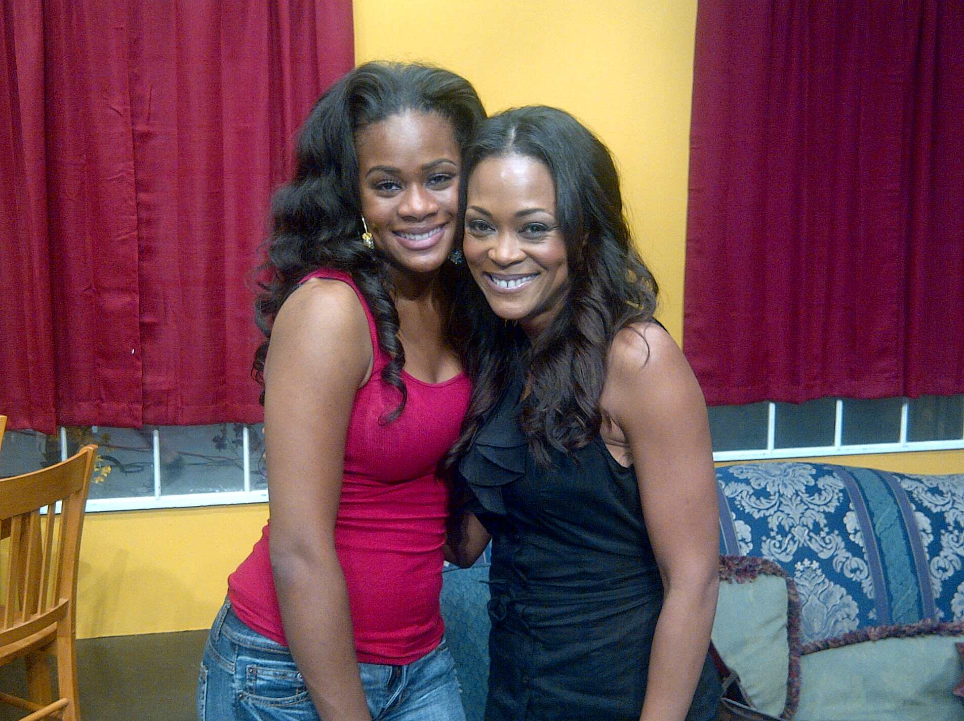 Cacilie Hughes and Robin Givens on set.