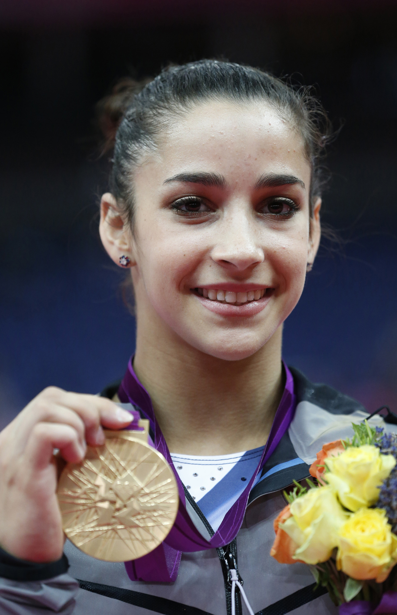 Gold medalist US gymnast Alexandra Raisman poses on the podium of the women's floor exercise of the artistic gymnastics event of the London Olympic Games.