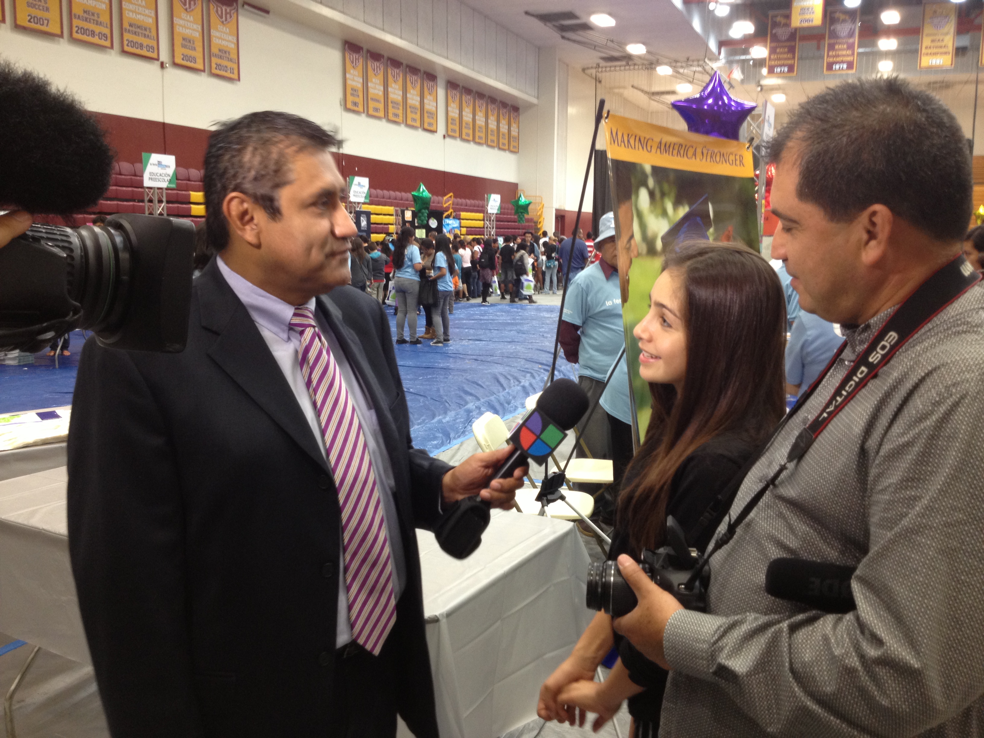 Samantha being interviewed by Univision after performing for them at a festival.