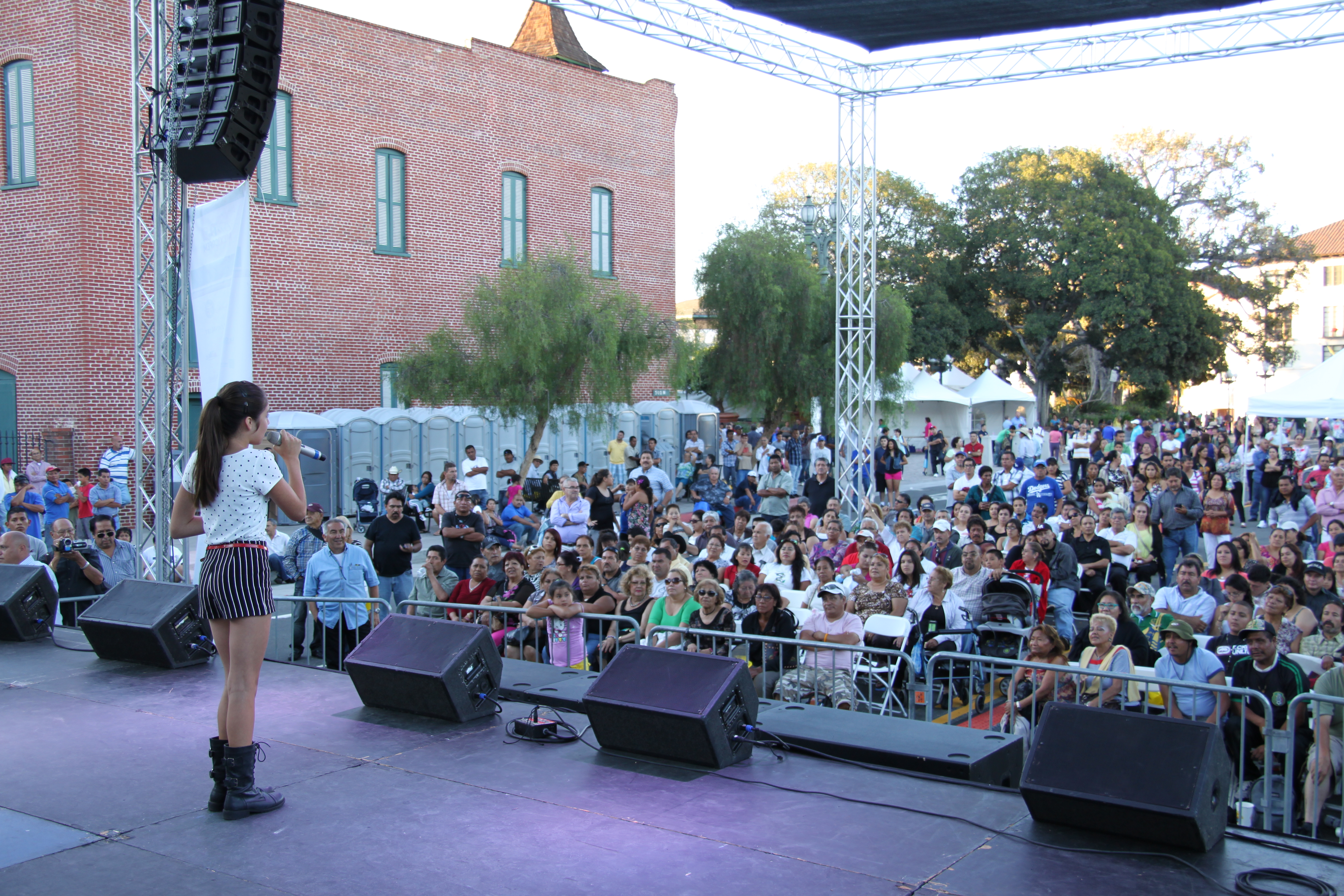 Samantha Elizondo performing in downtown LA at music festival.