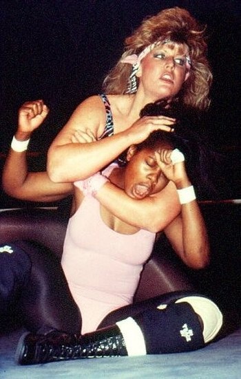 Pro Wrestler Olympia, finishes the match victoriously with a dynamic sleeper hold (Many many moons ago)