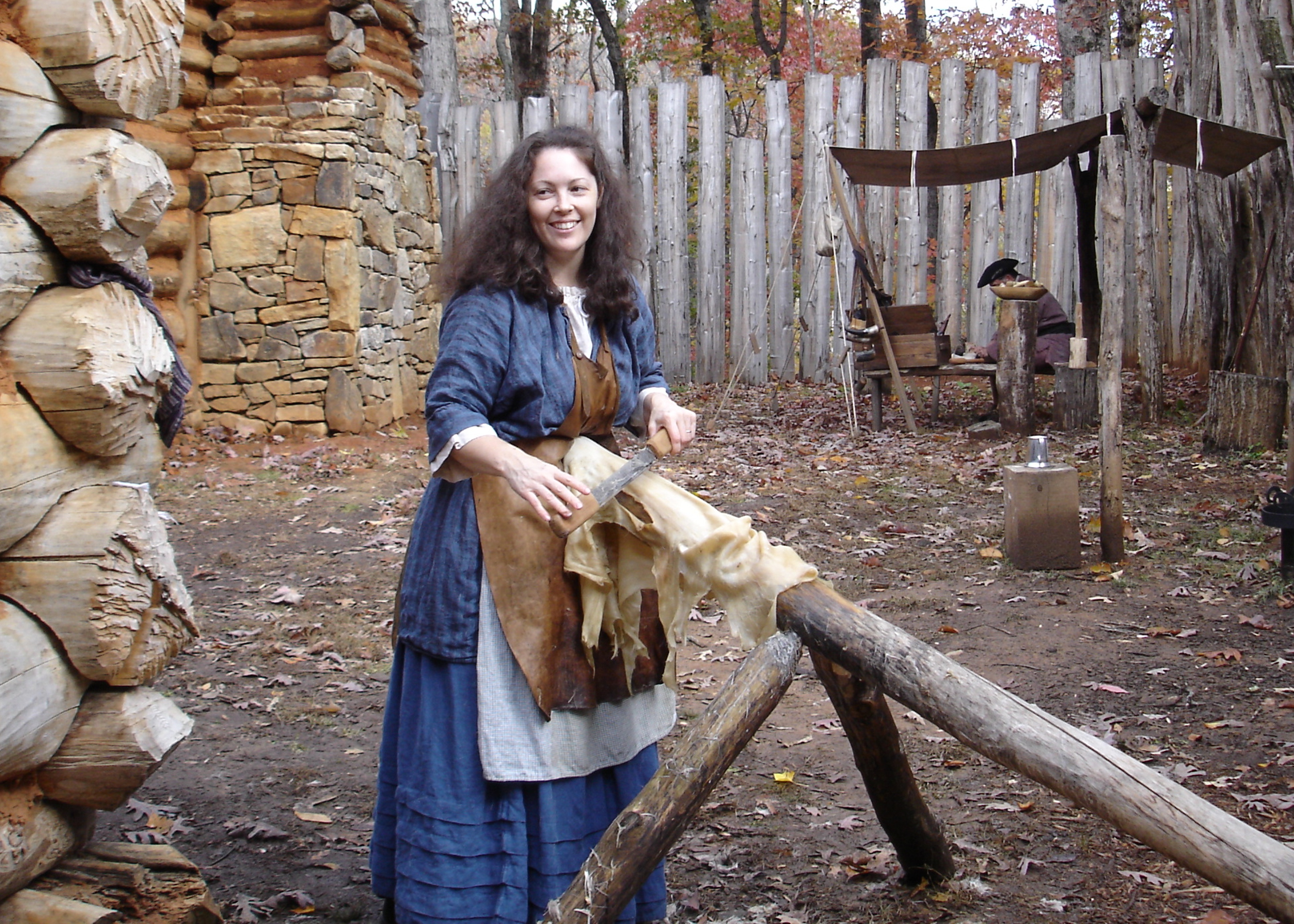 Melondy Phillips - scraping a deer hide