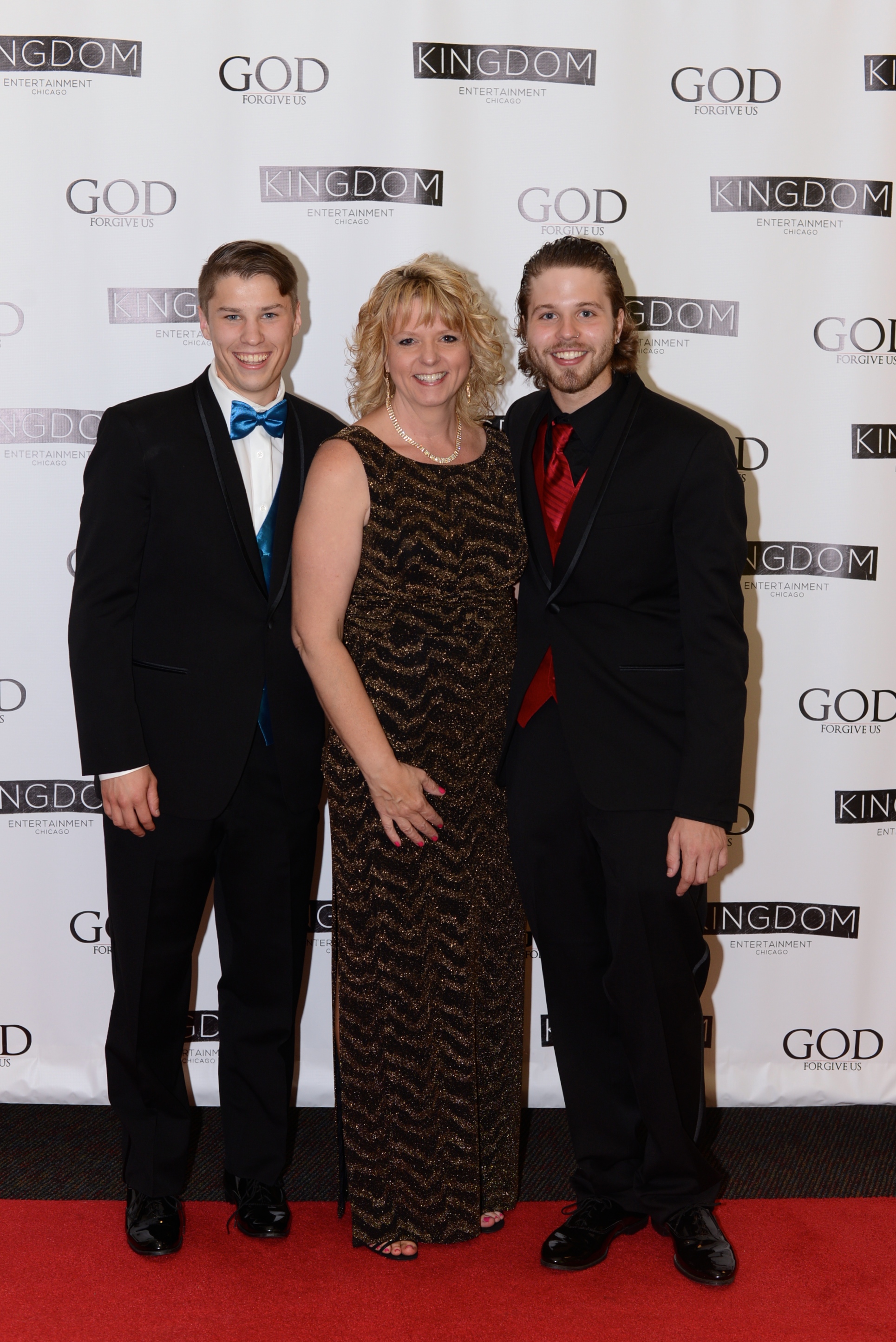 From Left to Right: Kyle Downs [Producer], Regina Bachochin [Executive Producer] and Michael Bachochin [Writer/Director] at the God Forgive Us Red Carpet Premiere in Kenosha, WI.