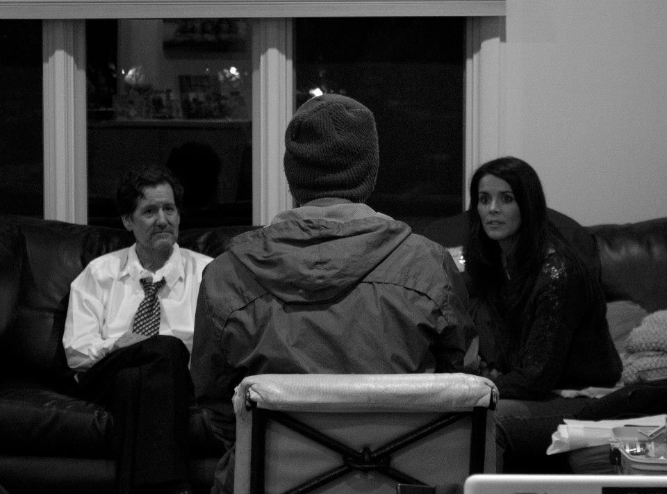 Discussing a scene with talent (from L to R): Brian Rooney, Michael Bachochin, and Kelly Steward.