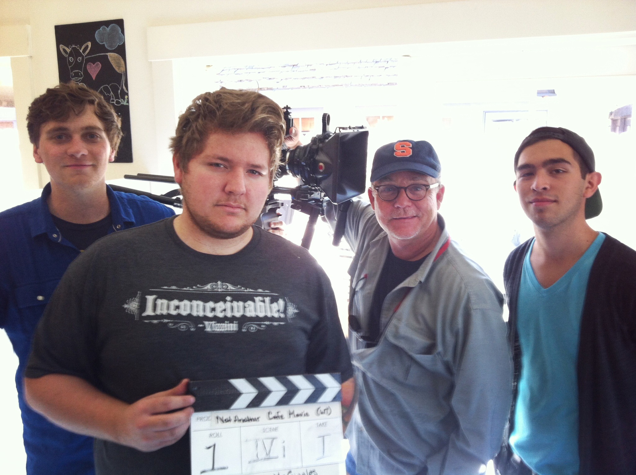 [Left to Right] Jonathon McGee (Writer, Director), Paul Kiszonas (Assistant Director), Taggart Lee (Director of Photography), and Javier Bueno (Camera Operator, Director of Photography) at Petite Reve Cafe during the filming of 