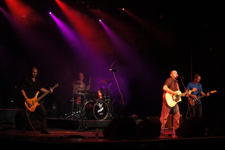 Playing live with the band.