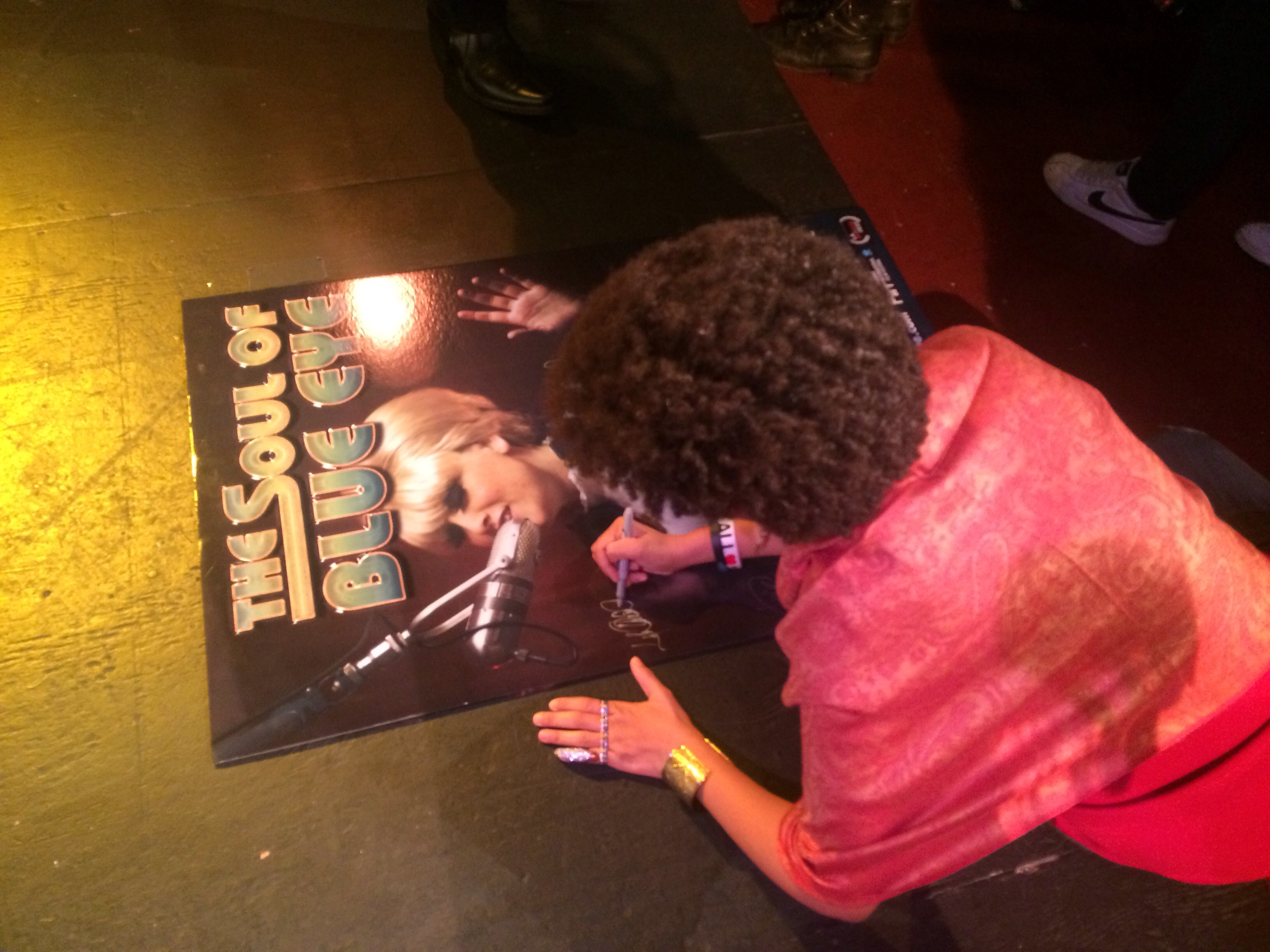 Lyn Quinn signing The Soul of Blue Eye poster for Loyal Studios while attending the LA Indie Film Festival.