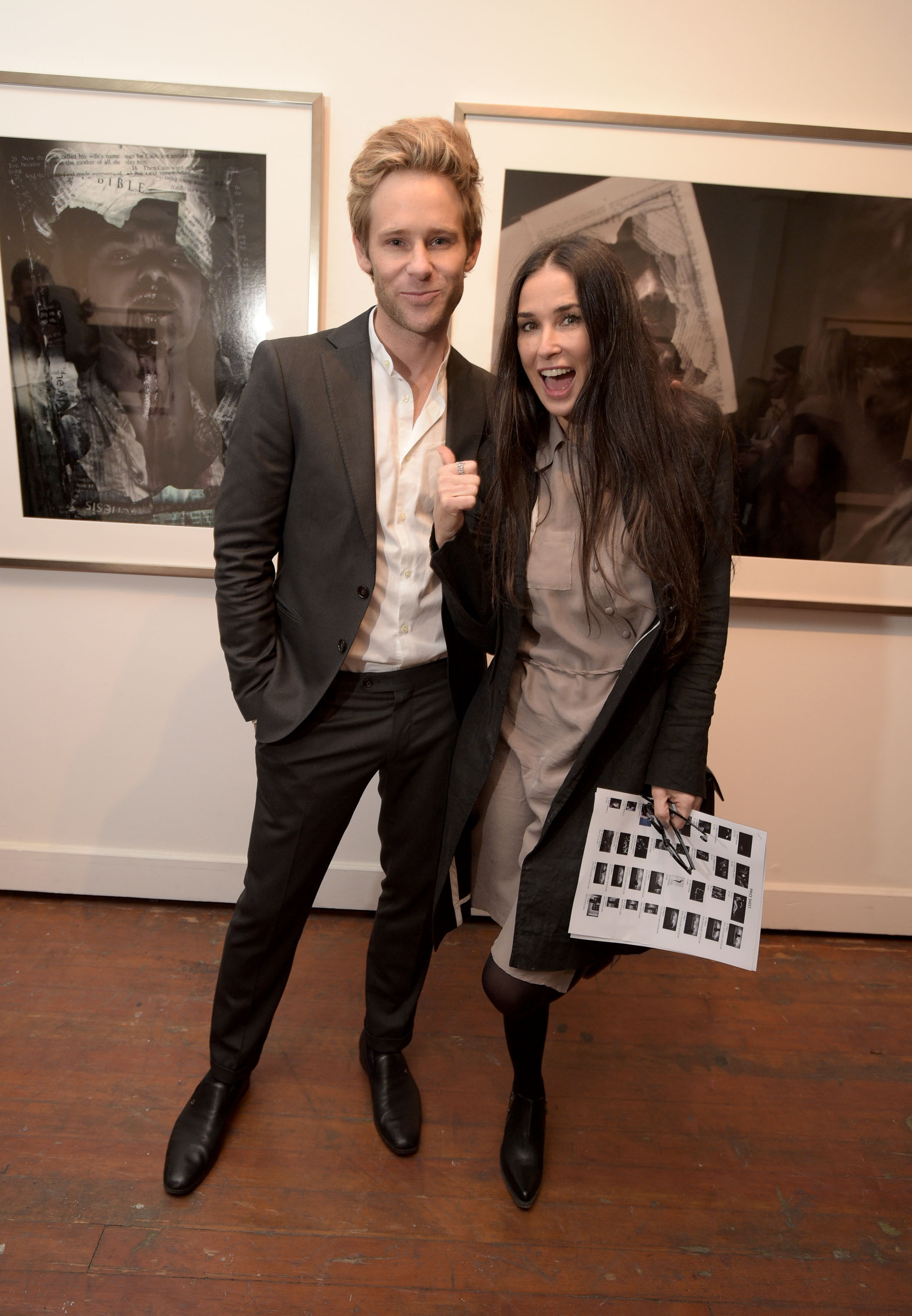 LOS ANGELES, CA - MAY 09: Artist Bryan Fox (L) and actress Demi Moore attend We. Alone. A photography exhibit by Bryan Fox at Think Tank Gallery on May 9, 2015 in Los Angeles, California. (Photo by Jason Kempin/Getty Images for Bryan Fox)