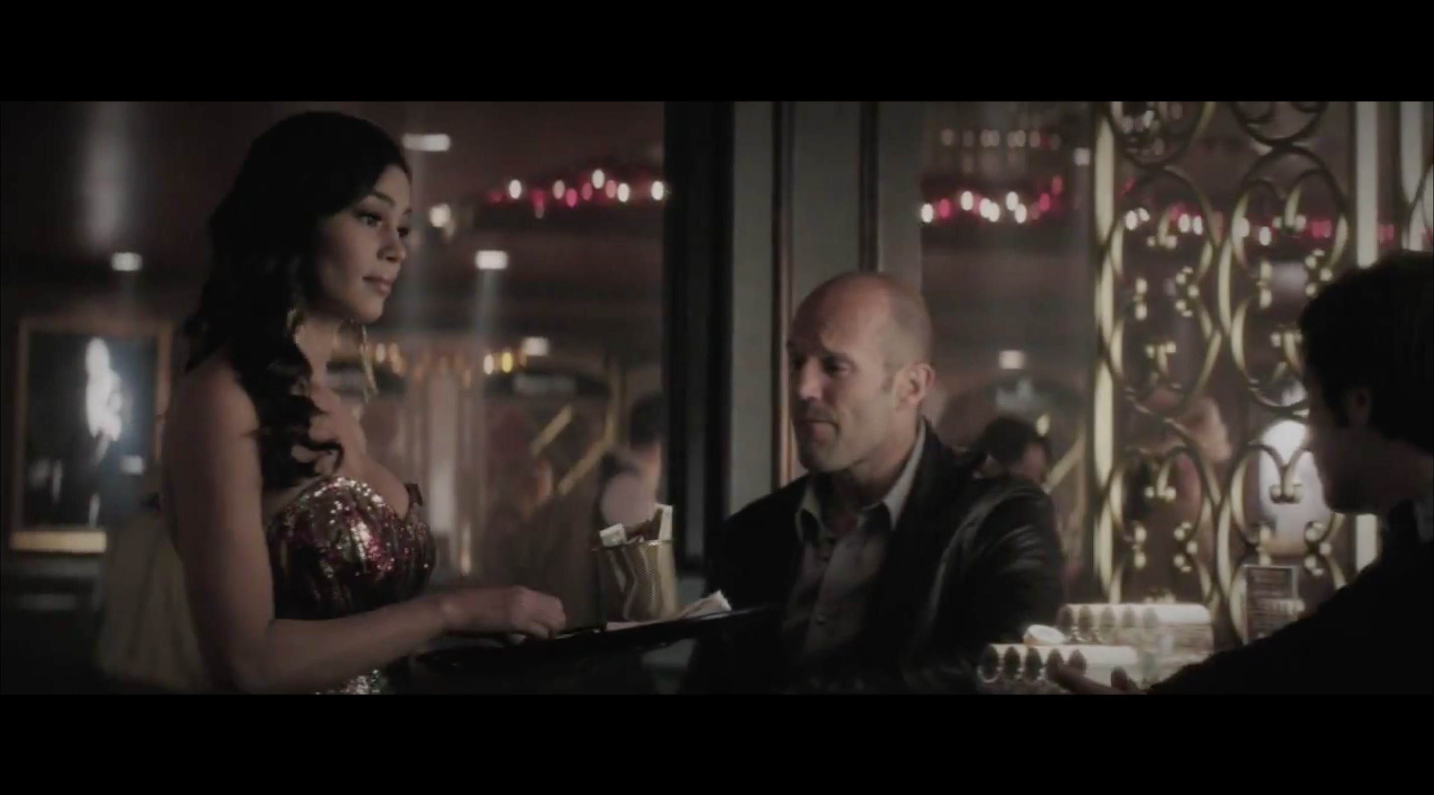 Screen shot from movie Wild Card with Jason Statham and Michael Angarano