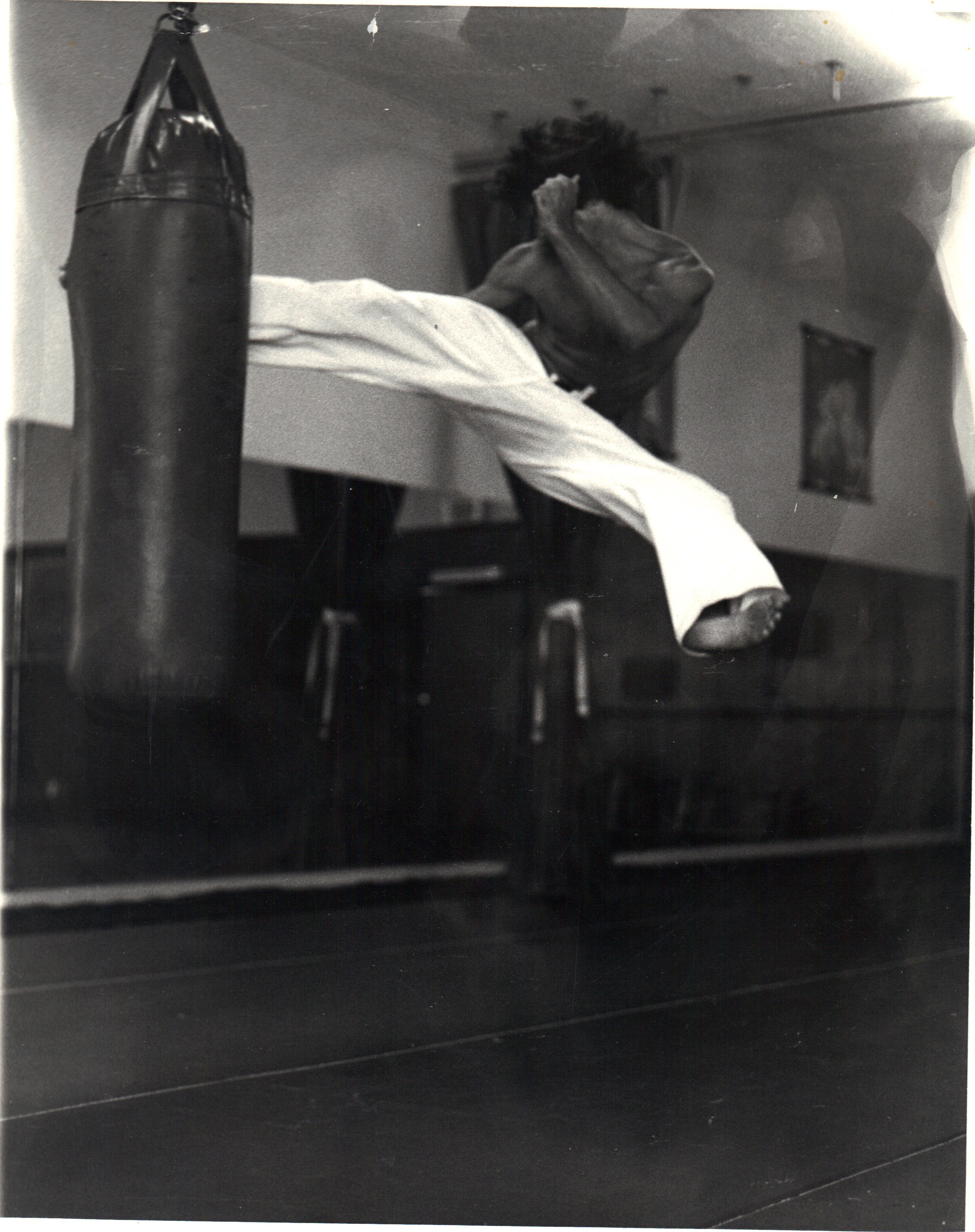 Don McGovern vintage shot,Jump spinning round kick into heavy bag. Chuck Norris days.....