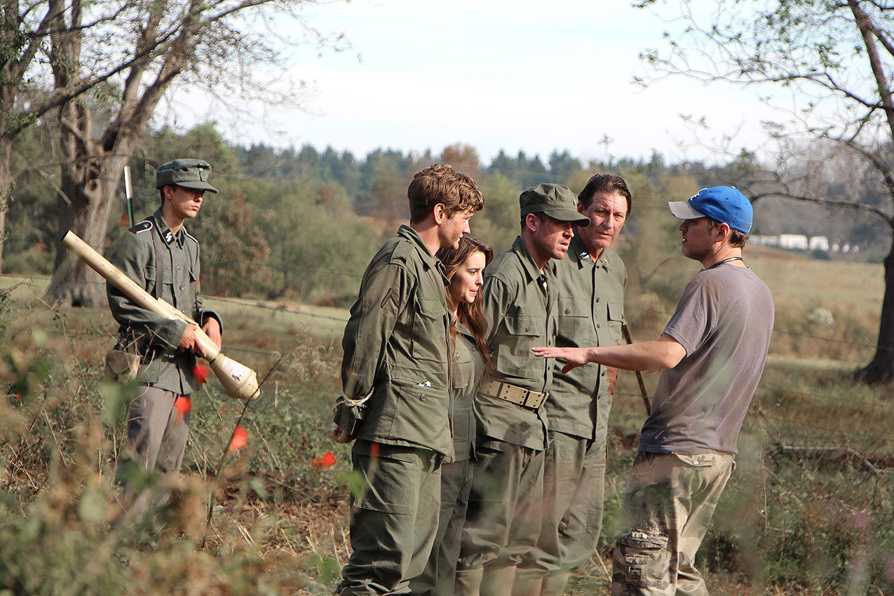 Director Eric Colley directs the actors in the World War II film The Last Rescue.