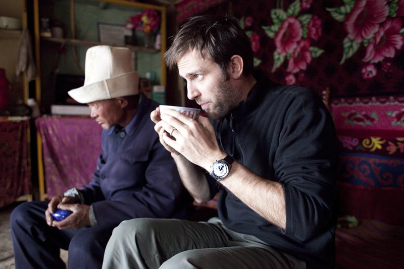 Ryan Pyle on the remote border of China and Tajikistan enjoying a hot cup of tea in a local villagers home. 2012.