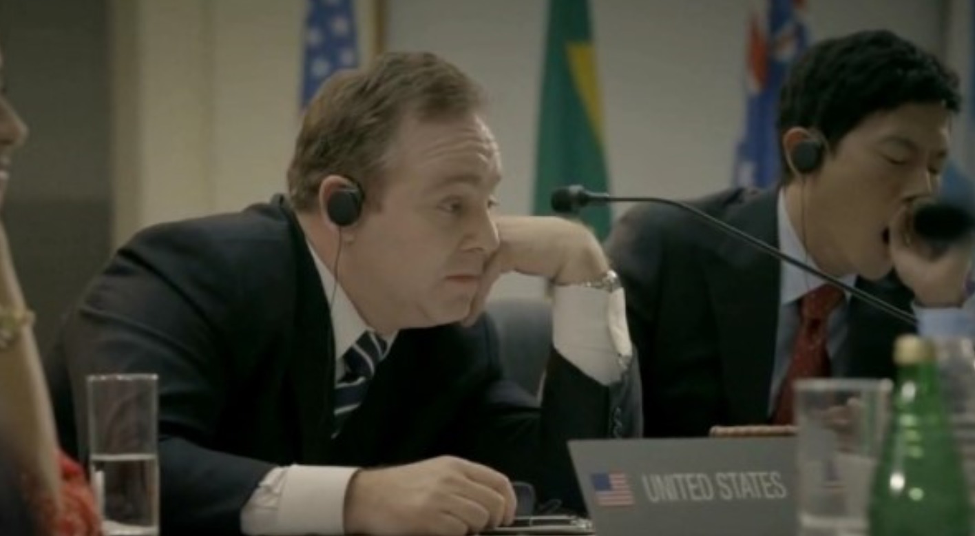 Dean Dawson as the bored-looking American Ambassador in a still for a Deng Deng Chicken commercial.