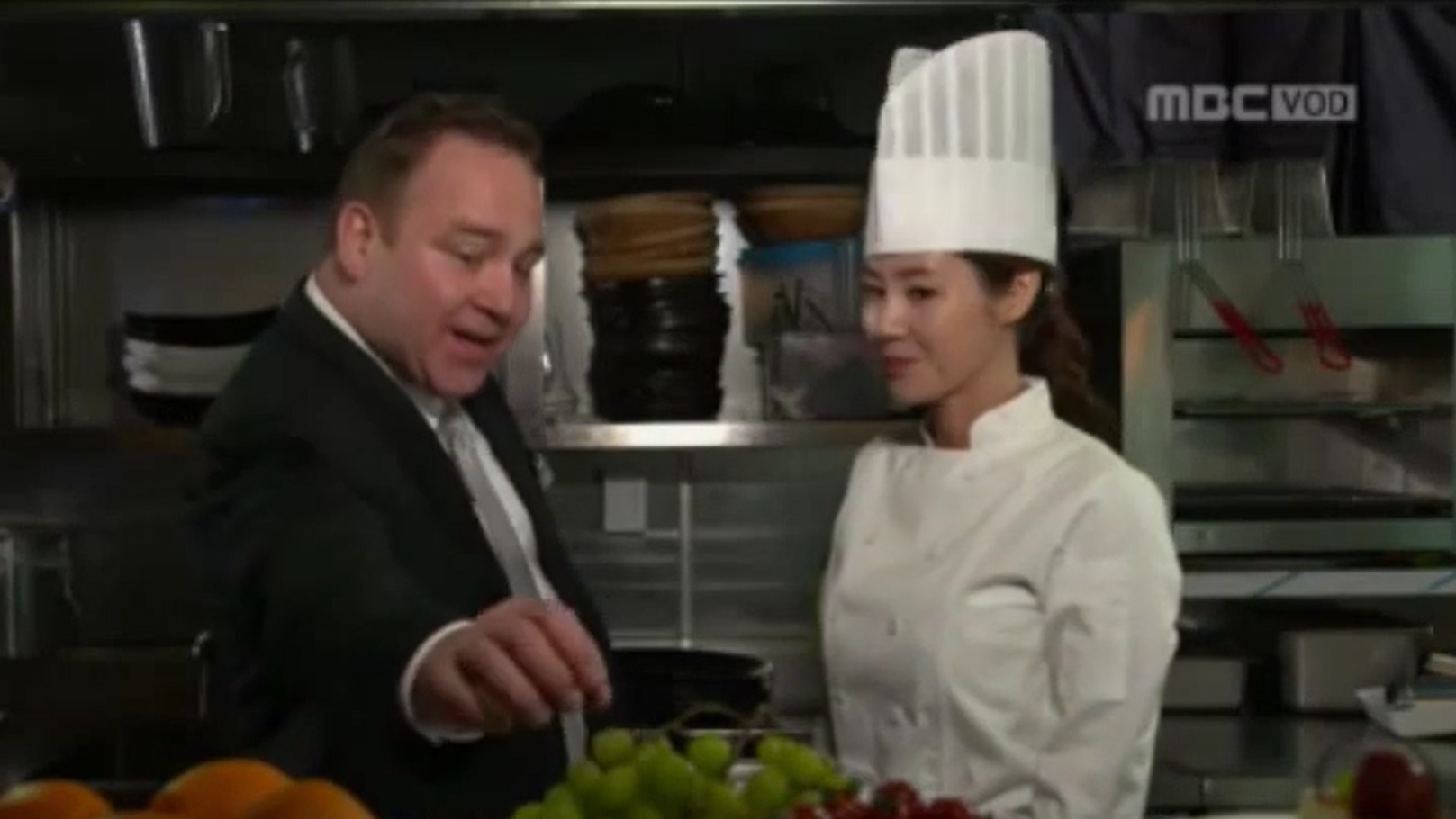 Still of Dean Dawson and Sung-Ryung Kim in Queen of the Flowers (2015).
