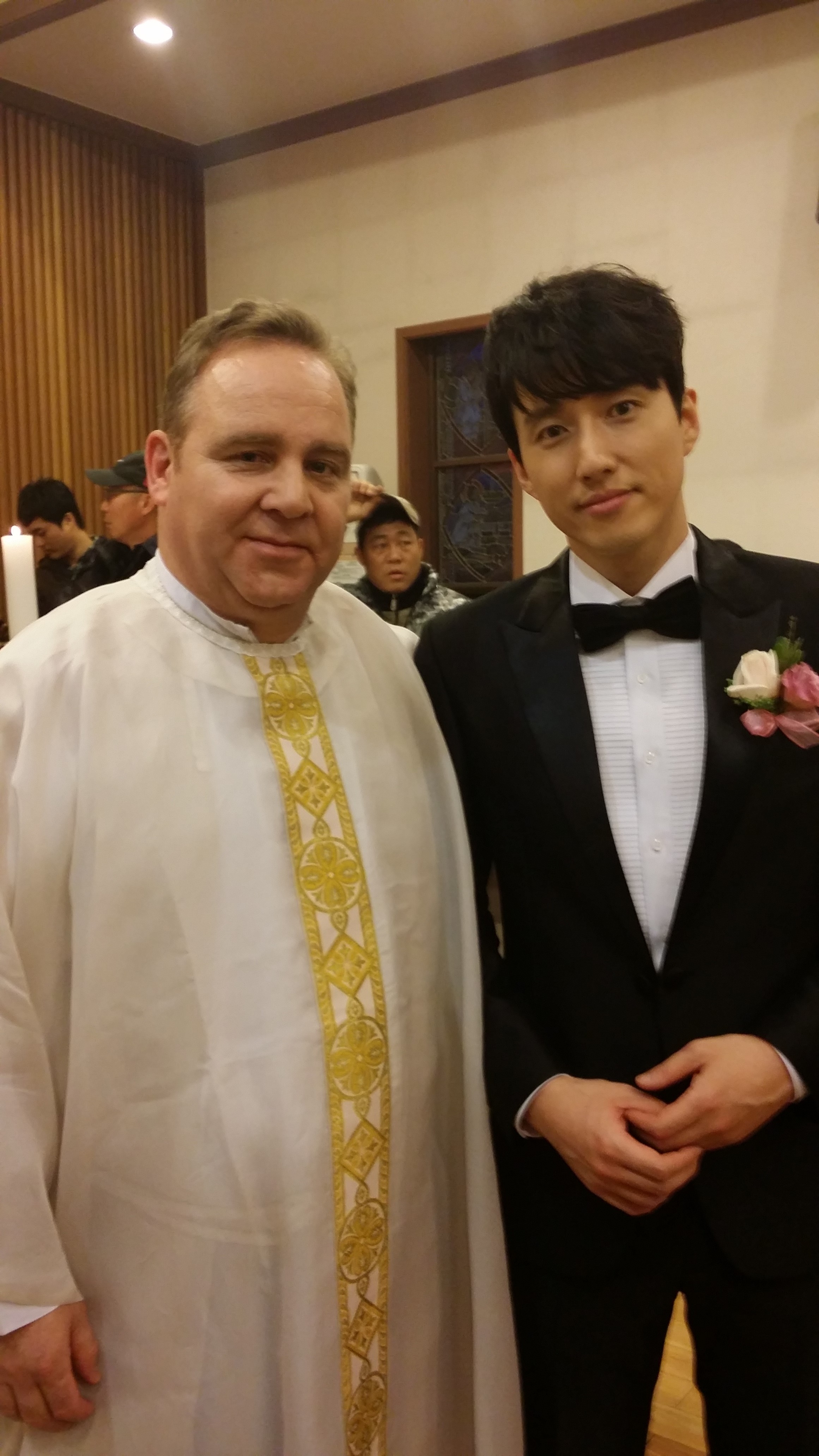 Dean Dawson is the priest with Jin-woo Jang as Philip Choi on location for the drama, Sweet Secrets on KBS television.